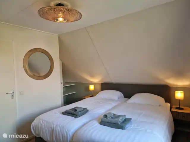 Slaapkamer met zicht op het park